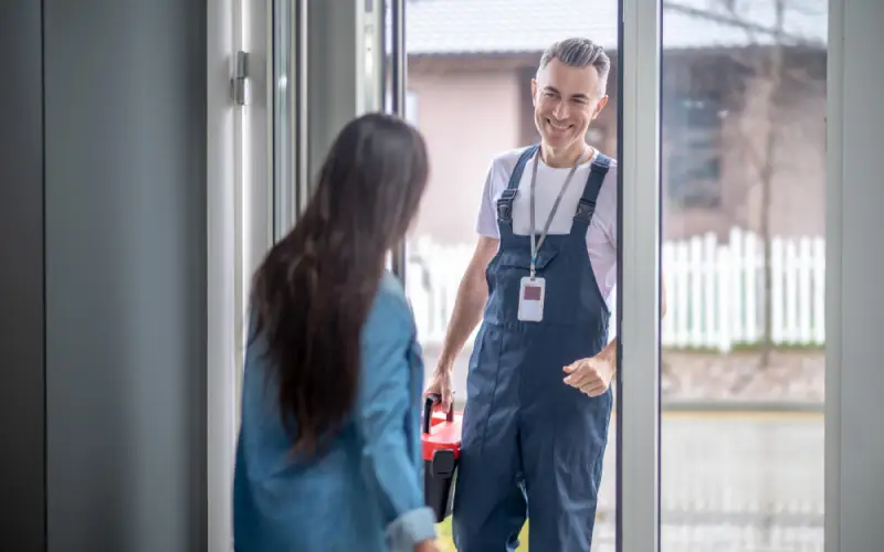 how to pick the right london locksmith,A man wearing overalls standing beside a woman in a relaxed environment